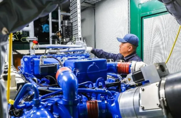 PowerLink technician inspects a generator